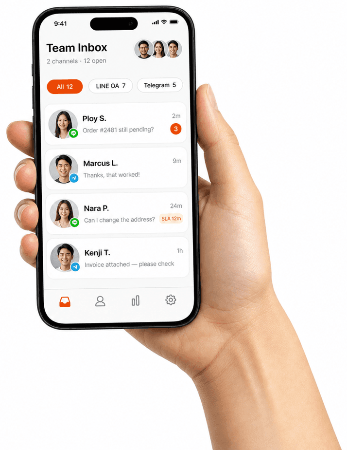 Hand holding a phone showing the ZeroX chats team inbox with LINE OA and Telegram conversations